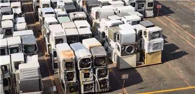 Old appliances await processing at the recycling plant.