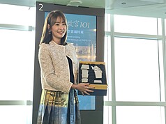 Janet Chia showcases a Taipei 101 and National Palace Museum co-branded tea gift set on Wednesday, October 14, 2026. (Photo: CNA)