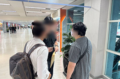 Jing's husband (right), surnamed Li, was arrested upon arrival at the Kaohsiung International Airport after returning from Japan on October 24, 2026. (Photo: CNA)