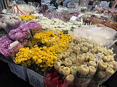 However, flowers that carry special cultural meaning, like chrysanthemums and lilies, will likely see price increases.  (Photo: CNA)