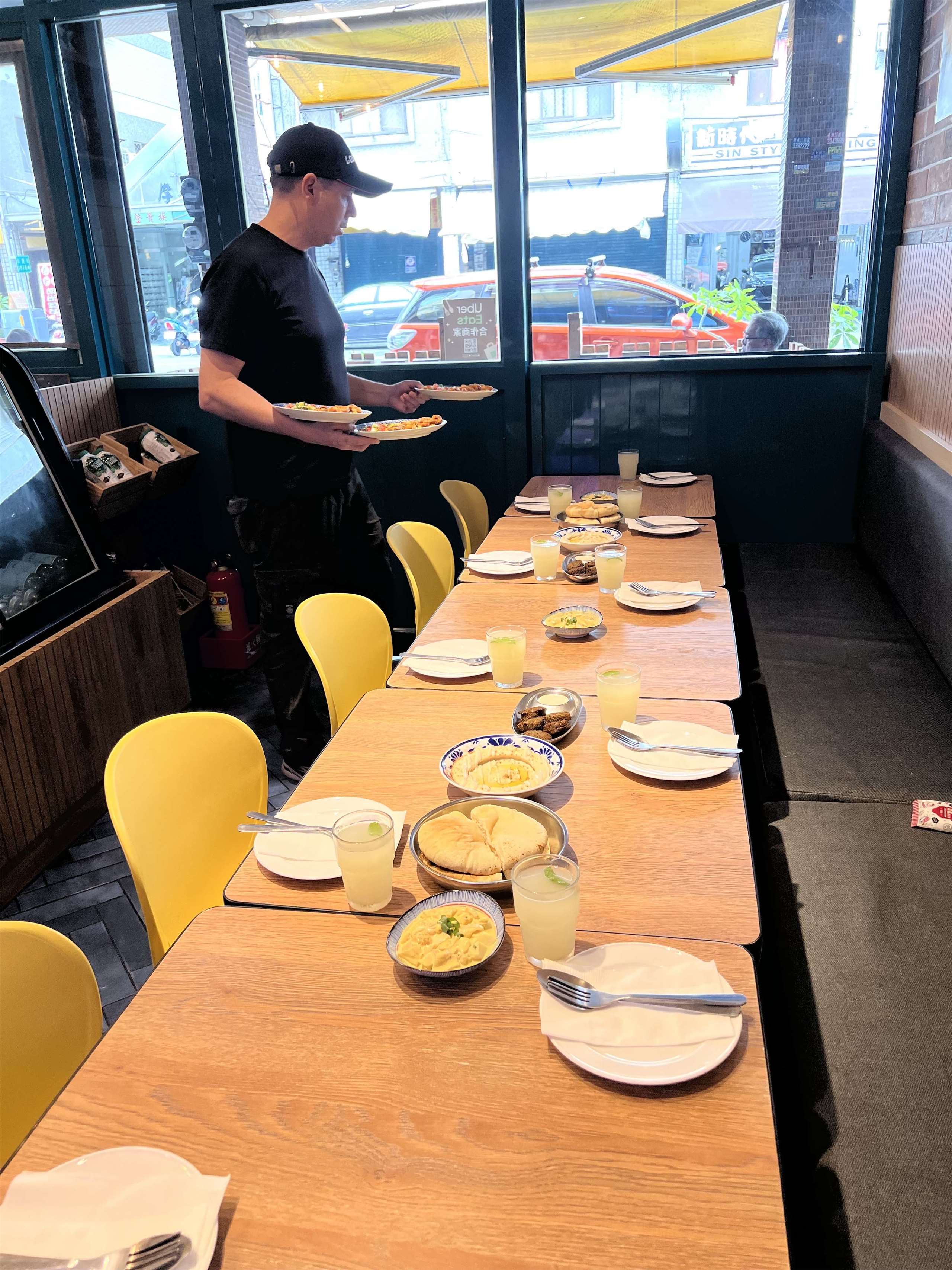 Working in different countries has taught Dan Orlovsky how to reach out to people of different backgrounds. Here, he is setting up a table for a group of students going to LoraCorlo to learn about Israeli food and culture. (Photo: Dan Orlovsky) 