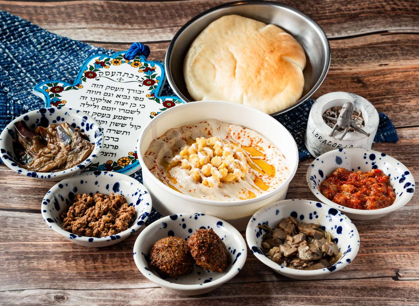Hummus, a chickpea paste that is very popular in Israel and throughout the Middle East, is seen here served at LoraCorlo with a side of pita bread & with different toppings for your choice. (Photo: Dan Orlovsky)