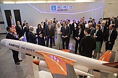A bipartisan senate delegation witnessed the unveiling of the white and orange drone, which employs a multi-purpose warhead weighing 12 kilograms with a dual-kill structure including steel ball fragments capable of penetrating armored vehicles and helicopters. (Photo: CNA)