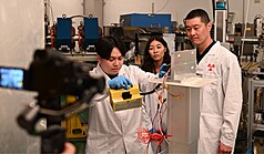 Loren Chang, Space Science and Engineering department chair and professor at NCU (right), led his team in testing a deep-space radiation detector at the National Atomic Research Institute's simulated proton accelerator. (Photo : CNA)