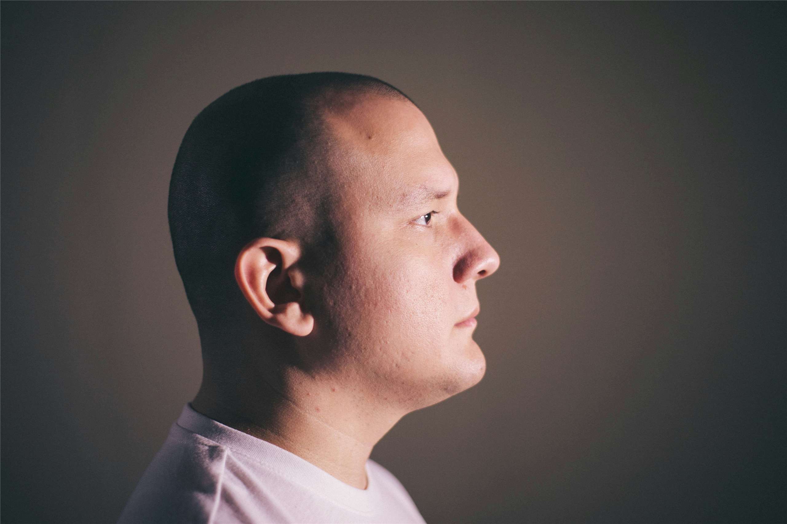 The head of a man. (Photo: Unsplash/Gustavo Sánchez)