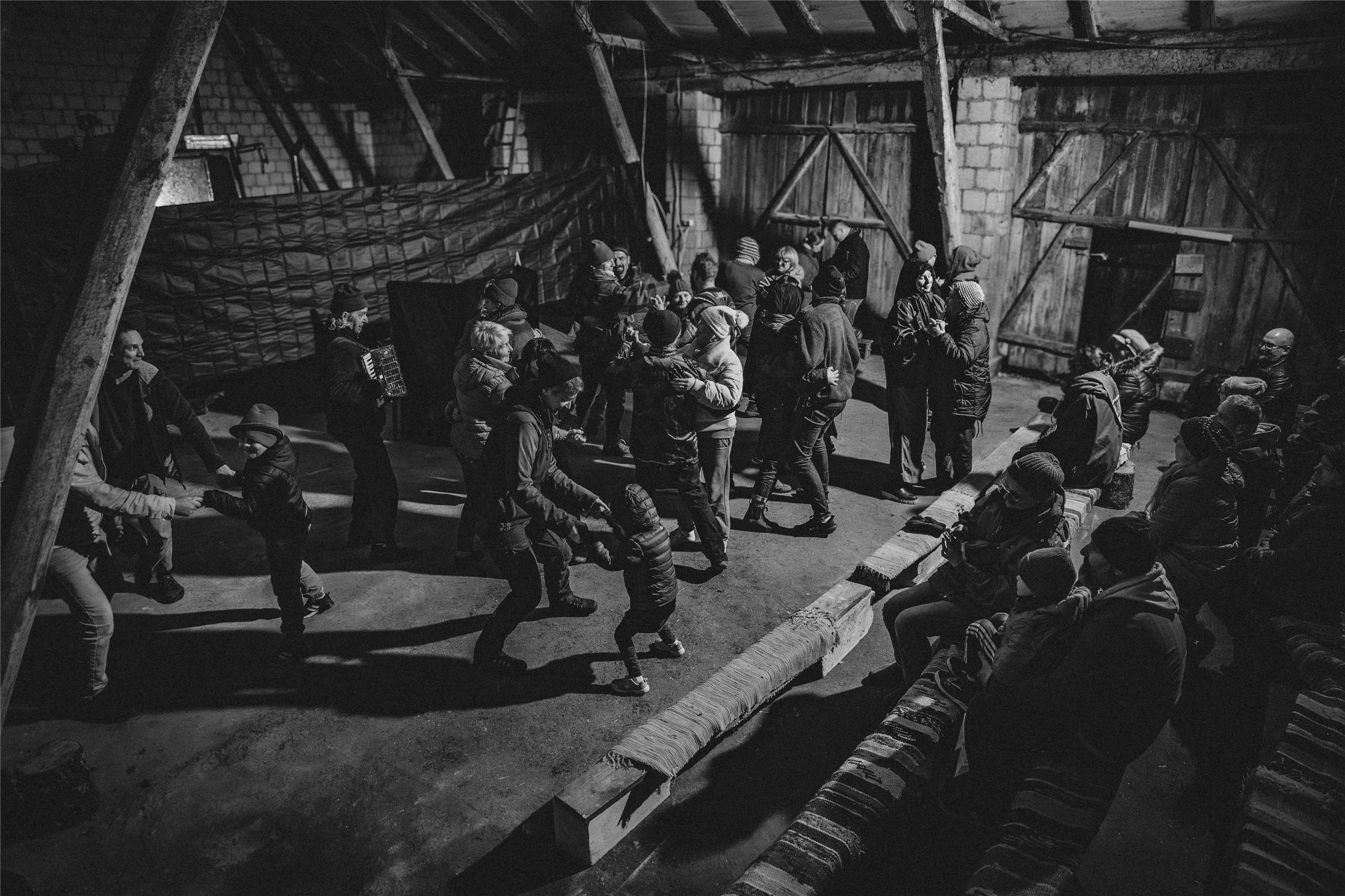 Singing and dancing with locals during a traditional caroling journey with Teatr Węgajty in the village of Dziadówek, near the Polish-Lithuanian border. (Photo provided by Hui Tsyr)