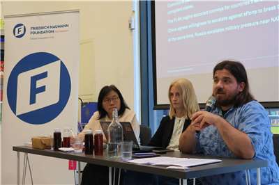 European Values Center for Security Policy Taiwan Office Senior Project Coordinator Olimpia Kot, center, and Head of Taiwan Office Marcin Jerzewski, right, present reports on defense resilience planning in Taipei on May 25, 2026. (Rti photo/James Thompson)