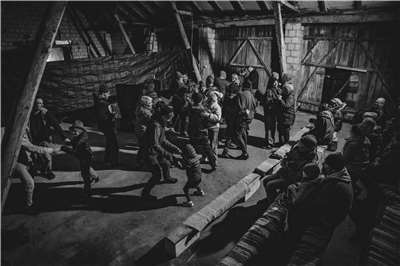 Singing and dancing with locals during a traditional caroling journey with Teatr Węgajty in the village of Dziadówek, near the Polish-Lithuanian border. (Photo provided by Hui Tsyr)