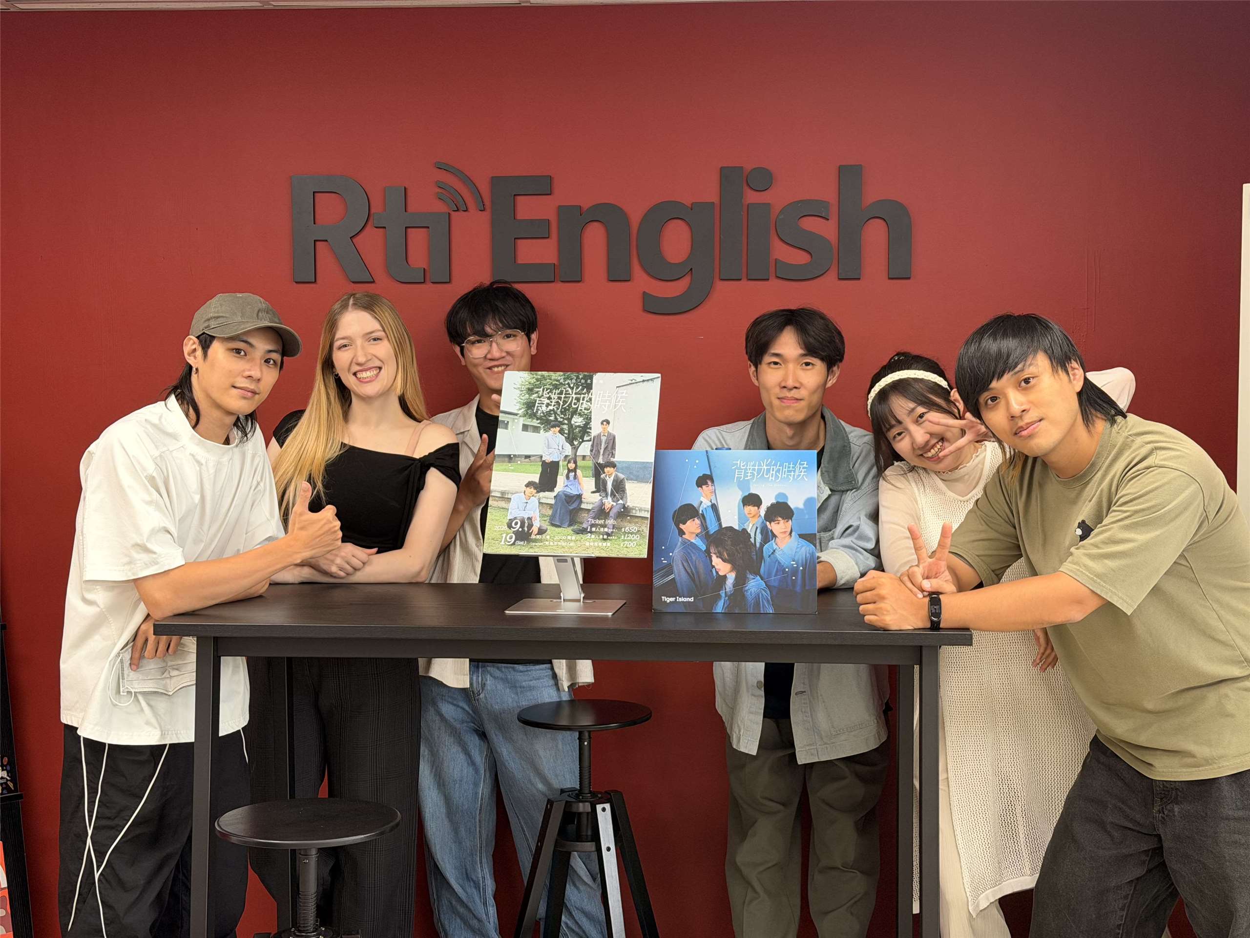 Host Tristan (second from left) is joined by the five Tiger Island members at the Rti English office. (Photo: Tristan/Rti)