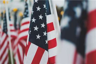 United States flags (Photo: Osman Rana/Unsplash)