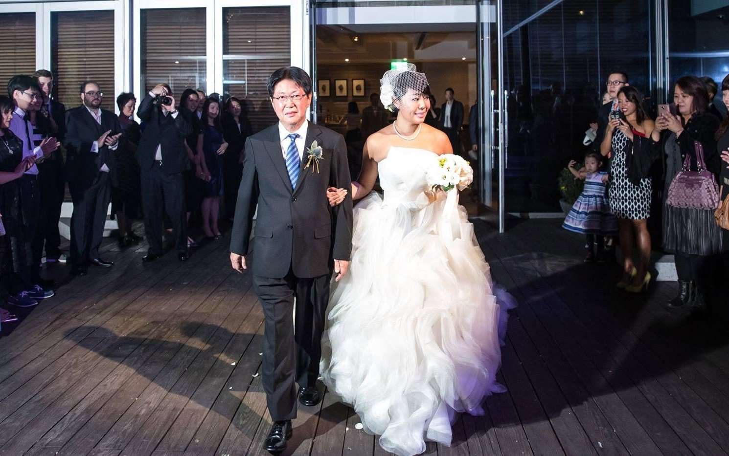 Michelle's dad walking her down the aisle! (Photo: Michelle Chiang)