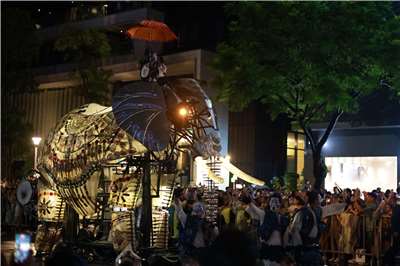 A performer rides atop one of the giant mechanical elephants as crowds watch “The Elephants Are Coming” in Taipei on September 6, 2026. (Rti Photo/James Thompson)
