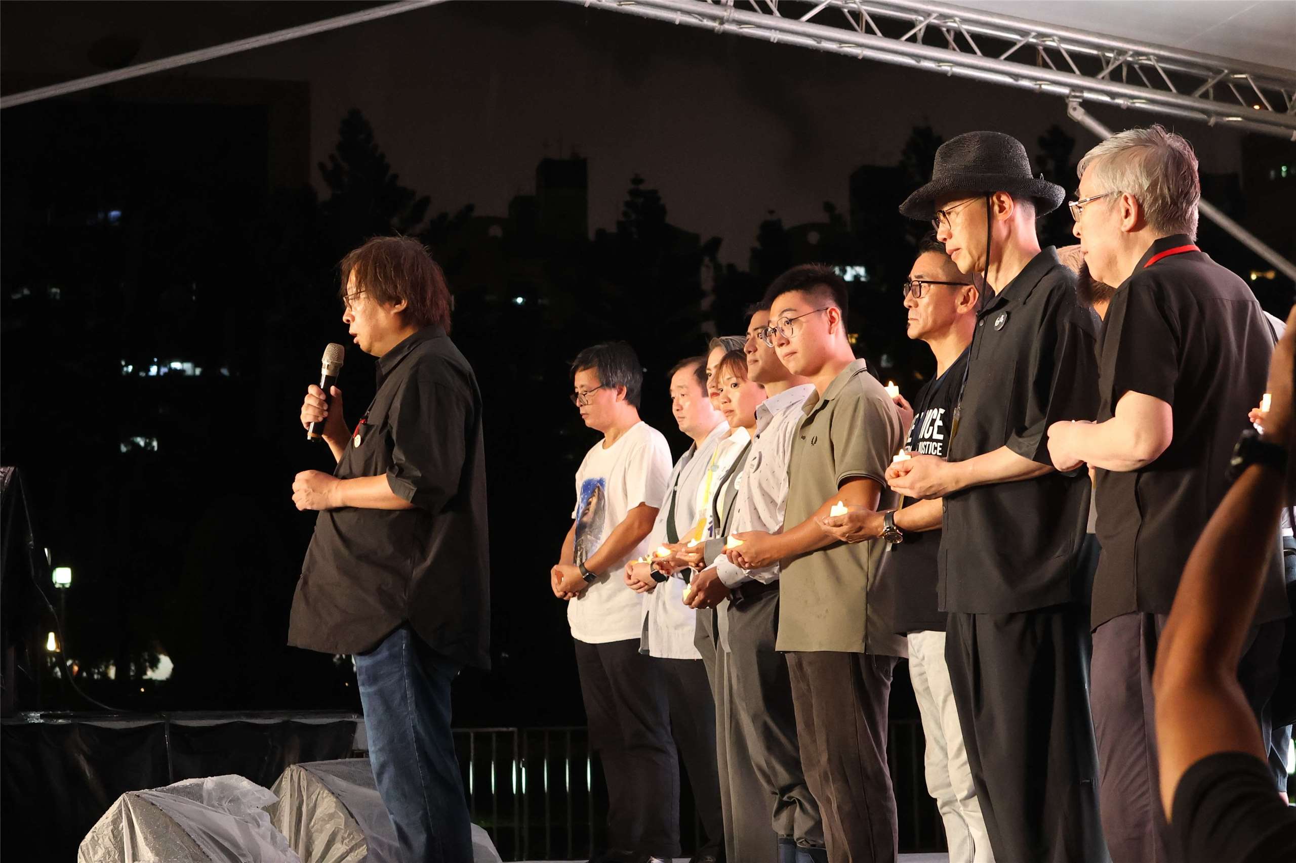 Organizers stand on a stage set up in Liberty Square in Taipei during a vigil marking the 37th anniversary of the Tiananmen Square Massacre. (Rti Photo/James Thompson)