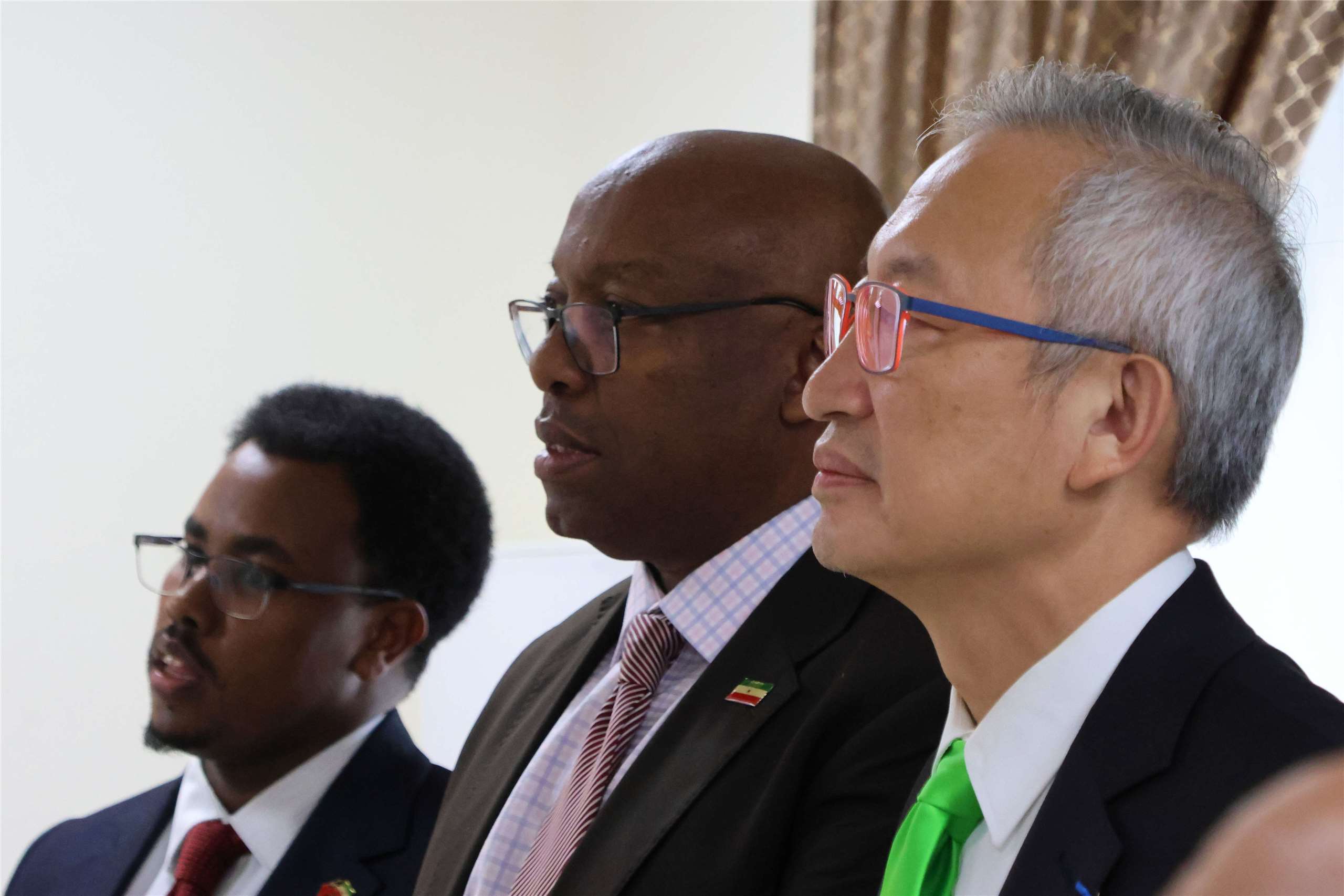 From left to right: Somaliland Representative Office First Secretary Abdiqani Muse Hassan, Ambassador Mahmoud Adam Jama Galaal and Taiwan Deputy Foreign Minister François Wu watch a promotional video at Somaliland’s new office on June 12, 2026. (Rti Photo/James Thompson)