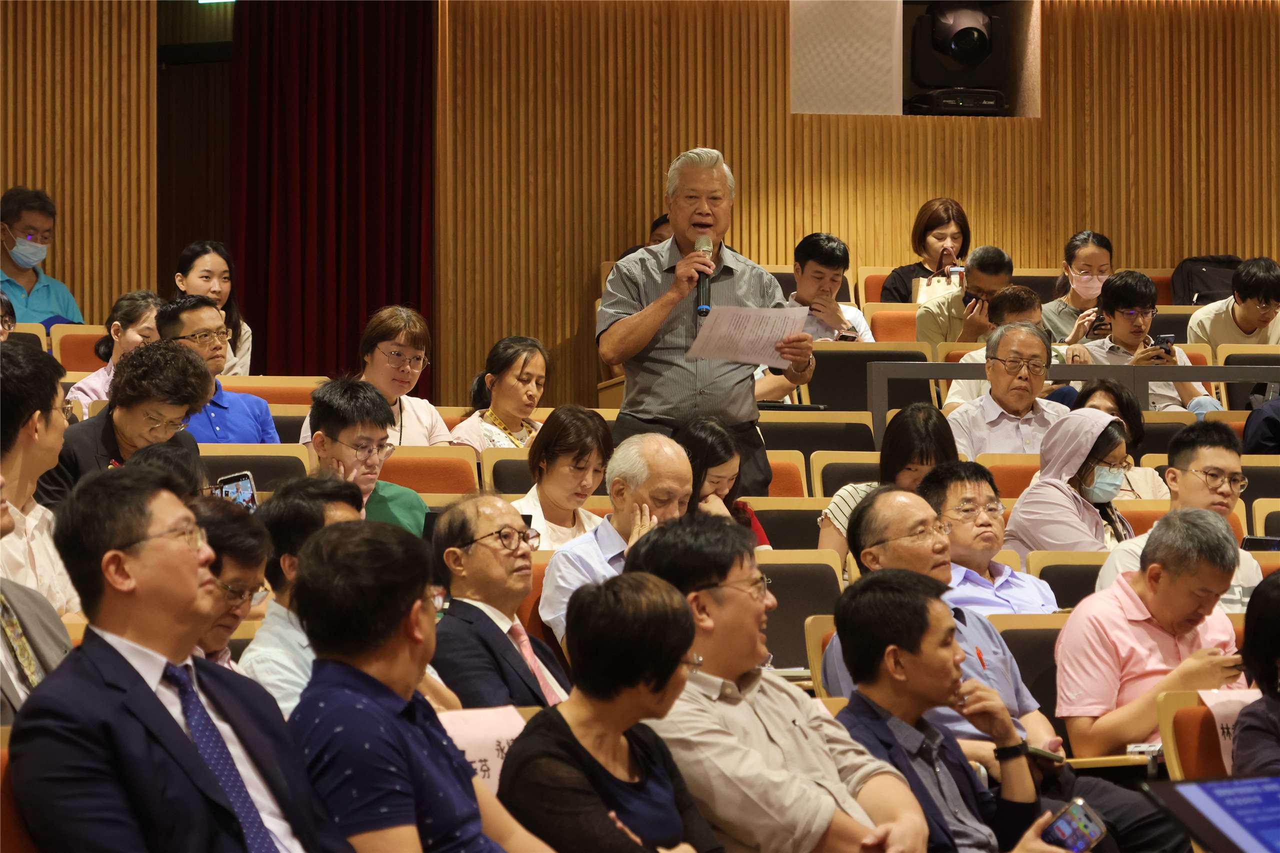 Environment Minister Peng Chi-ming, seated second from left in the front row, listens as a participant speaks during the public consultation in Taipei on July 20, 2026. (Rti Photo/James Thompson)