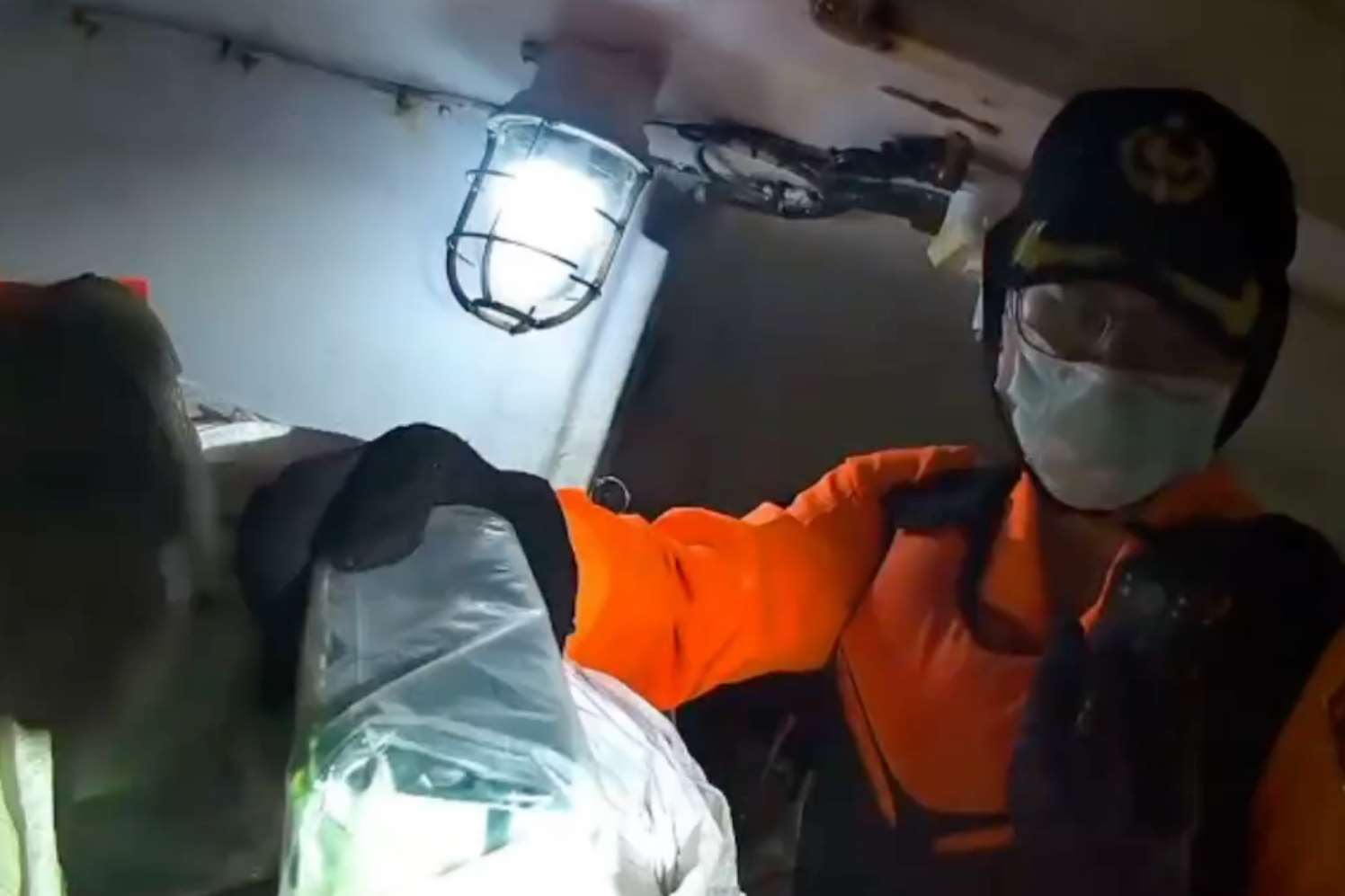Investigators find illegal narcotics in the hold of the fishing boat on December 3, 2025. (Photo: MJIB/Video screenshot)