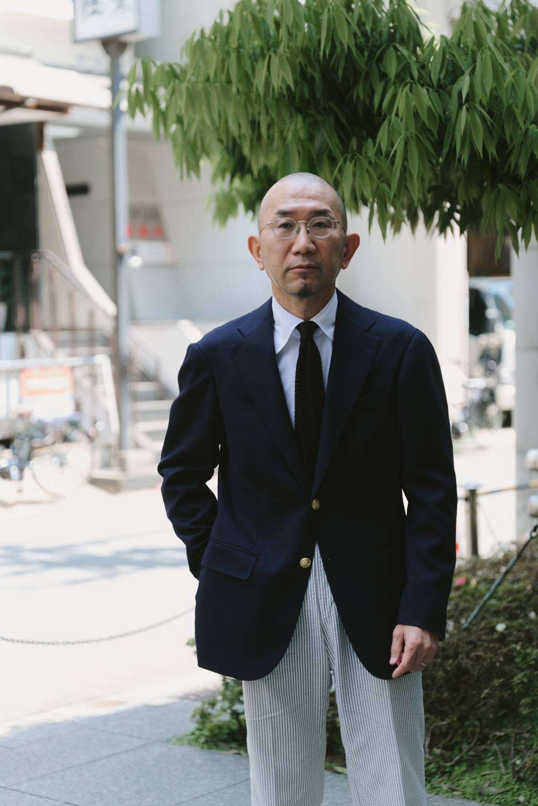 1954に設立されたスーツブランドRINGJACKETのWHOLESALE Div. MANAGERである笹本英利さんです。（写真：OakRoom）