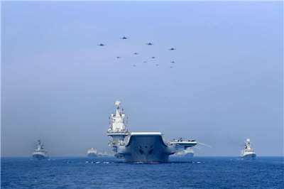 Chinese People's Liberation Army Navy ships and fighter jets conduct exercises in the South China Sea. (Reuters/Dazhi Images)