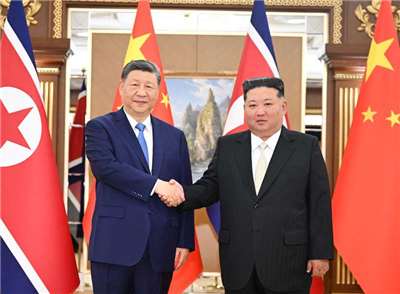 中國國家主席習近平8日在平壤會見北韓領導人金正恩。 (圖:翻拍自中國政府網)